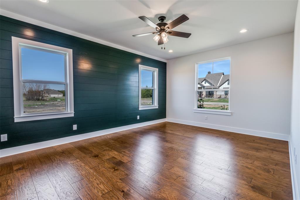 820 Evergreen Way Nevada, TX 75173 - Photo 28 of 37 a view of an empty room with window and wooden floor