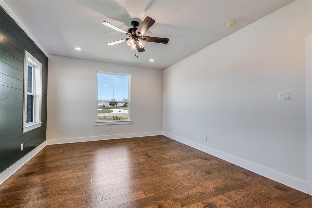 820 Evergreen Way Nevada, TX 75173 - Photo 30 of 37 wooden floor in an empty room with a window