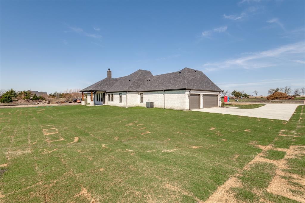 820 Evergreen Way Nevada, TX 75173 - Photo 36 of 37 a house with garden in front of it