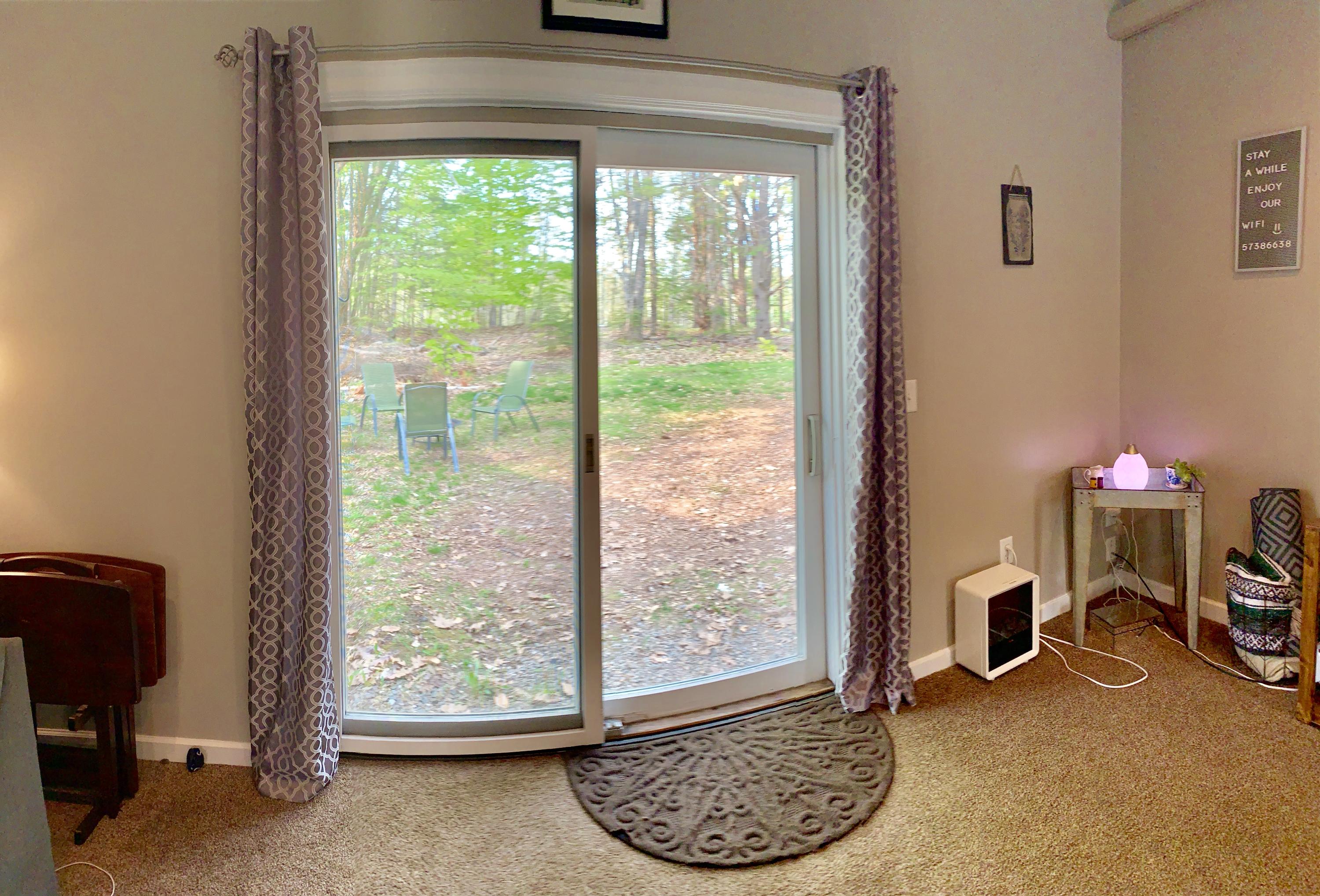 862 Levenseller Road Holden, ME 04429 - Photo 6 of 24 Sliders Leading to a Private Backyard