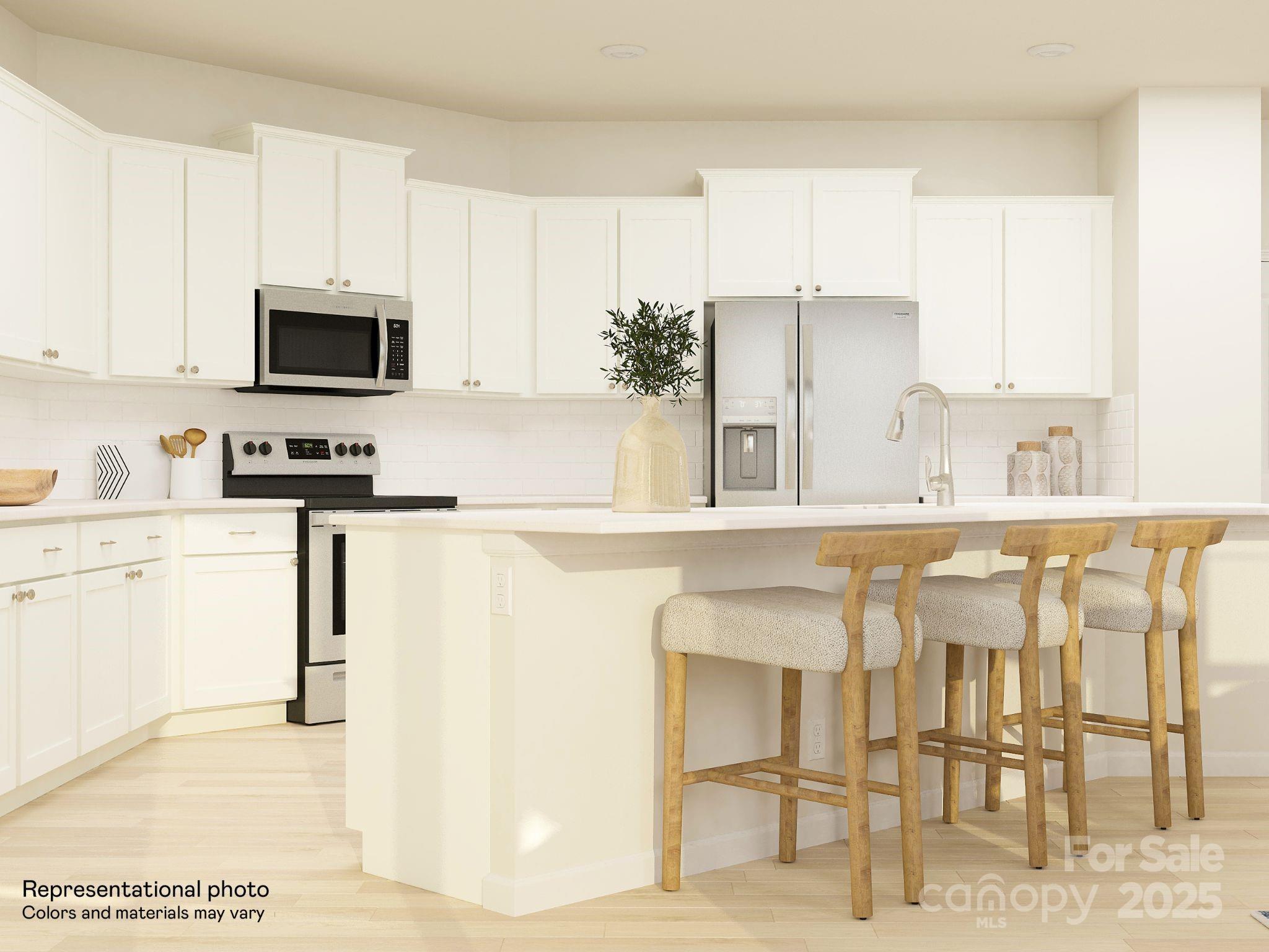 4262 Skyboat Circle Fort Mill, SC 29715 - Photo 7 of 44 a kitchen with stainless steel appliances kitchen island granite countertop a sink and cabinets