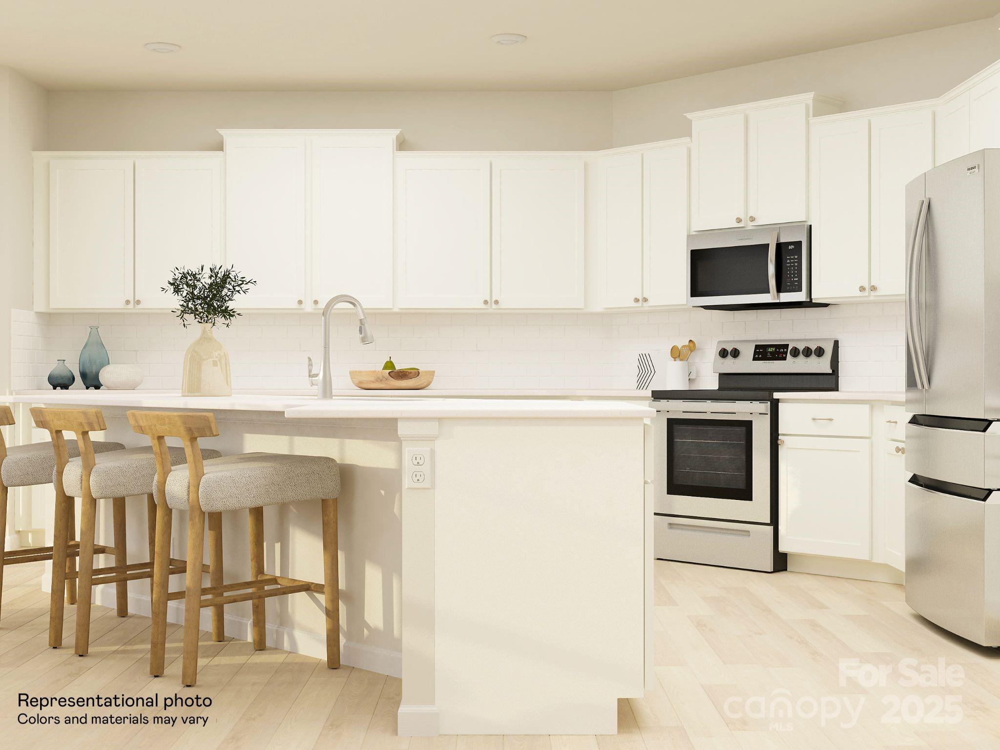 4262 Skyboat Circle Fort Mill, SC 29715 - Photo 8 of 44 a kitchen with stainless steel appliances kitchen island granite countertop a sink and cabinets