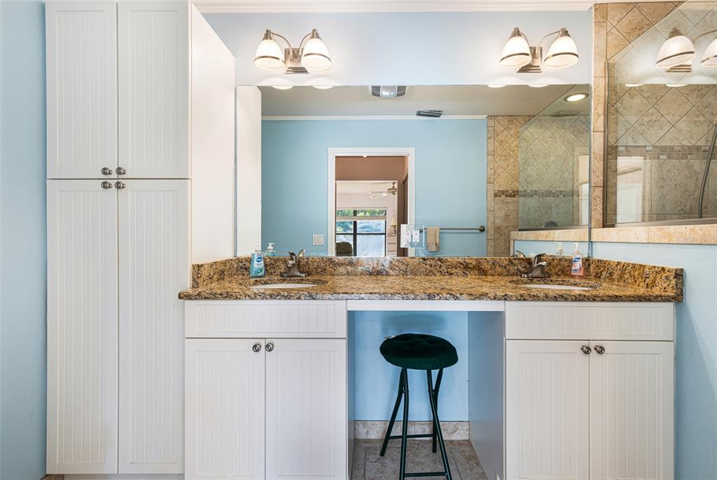 3041 Matecumbe Key Road, Unit 4 Punta Gorda, FL 33955 - Photo 15 of 33 a bathroom with a granite countertop sink and a mirror