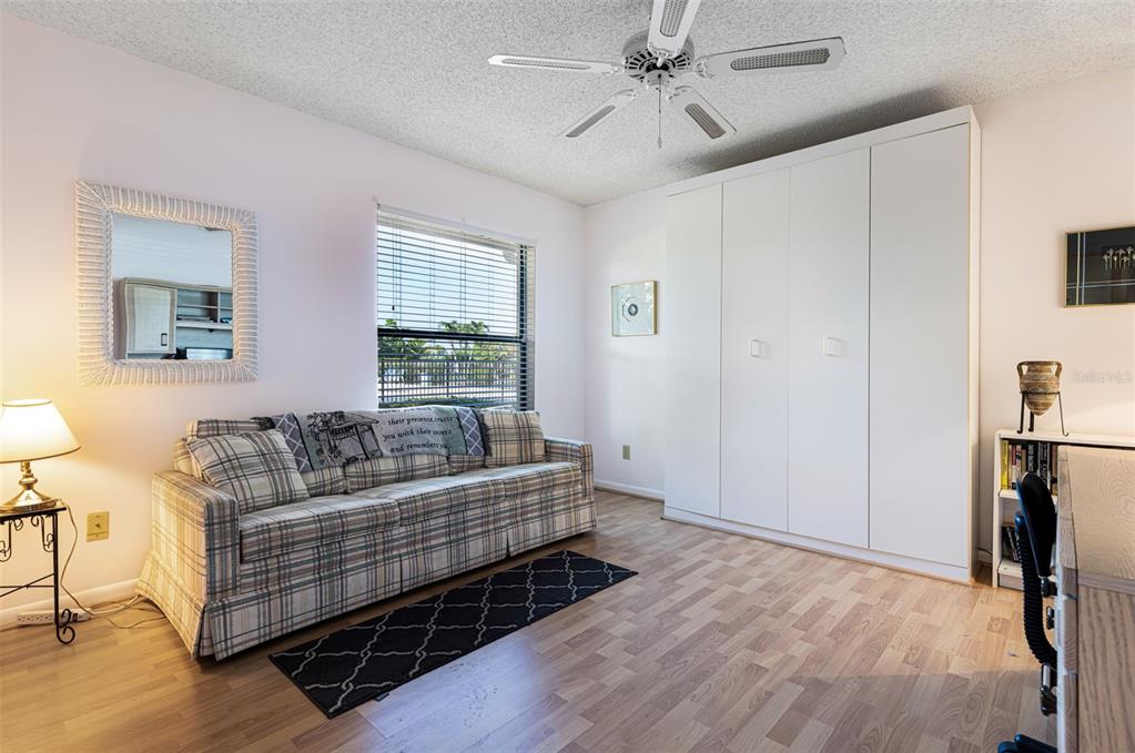 3041 Matecumbe Key Road, Unit 4 Punta Gorda, FL 33955 - Photo 26 of 33 a living room with furniture a flat screen tv and a window