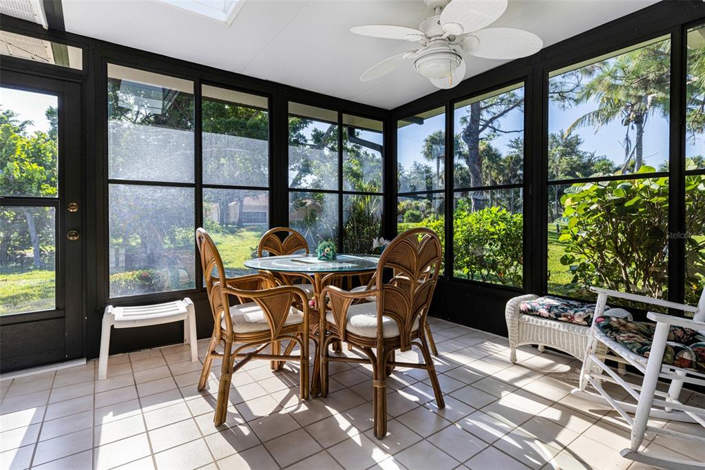 3041 Matecumbe Key Road, Unit 4 Punta Gorda, FL 33955 - Photo 29 of 33 a dining room with furniture and large windows