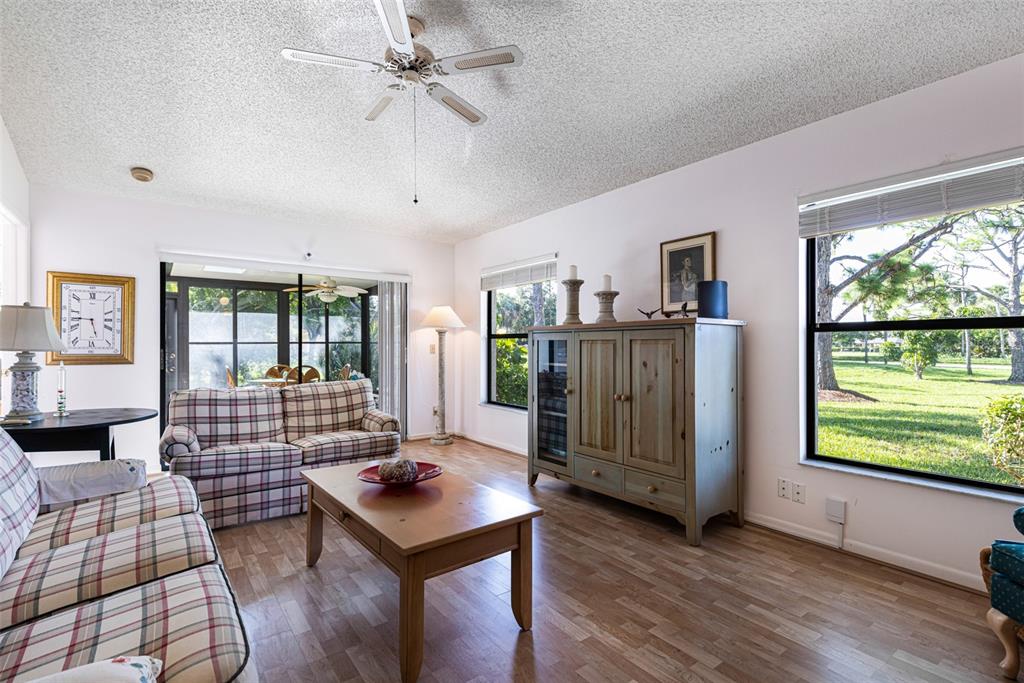 3041 Matecumbe Key Road, Unit 4 Punta Gorda, FL 33955 - Photo 7 of 33 a living room with furniture and wooden floor
