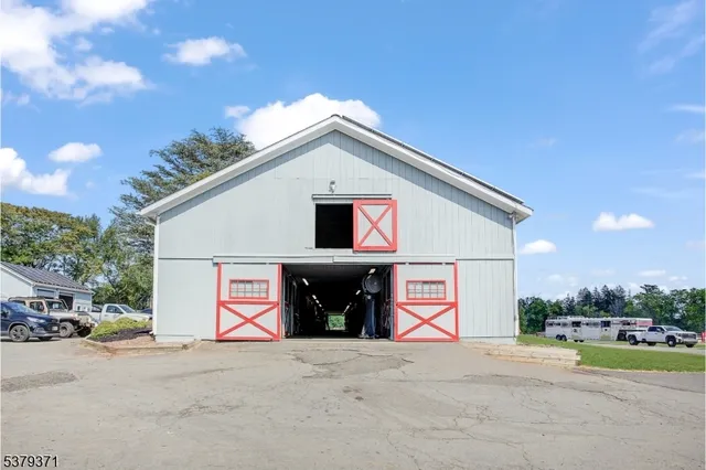 a view of a house with a yard and garage