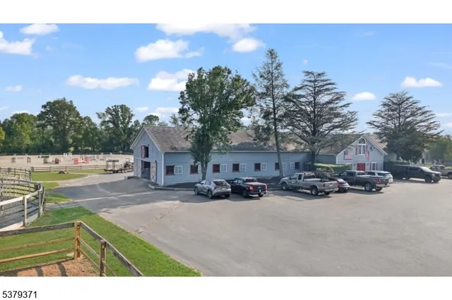 a view of a house with outdoor space and sitting area