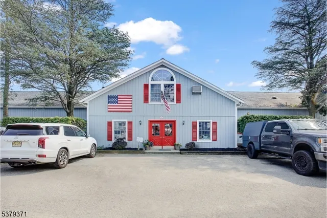 a view of a car parked in front of a house