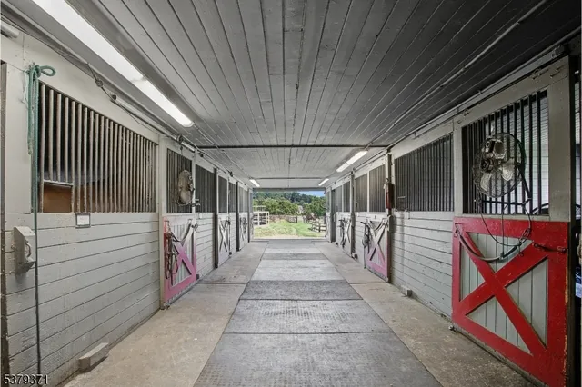 a view of two chairs in the balcony