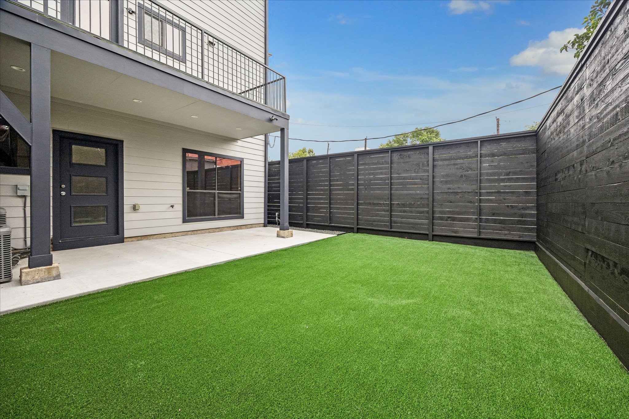 2510 Genesee Street Houston, TX 77006 - Photo 34 of 40 Backyard is features a concrete patio area new fence and new synthetic turf grass