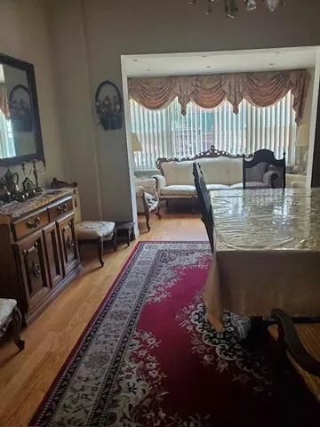 a living room with furniture and a rug