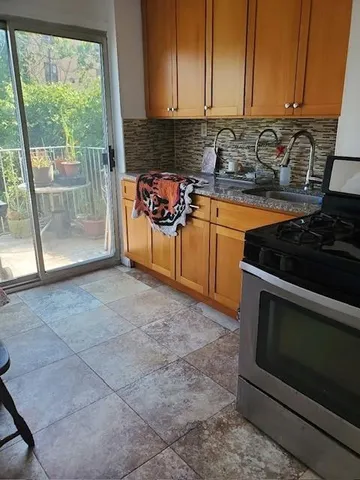 a view of a chair and table in the balcony
