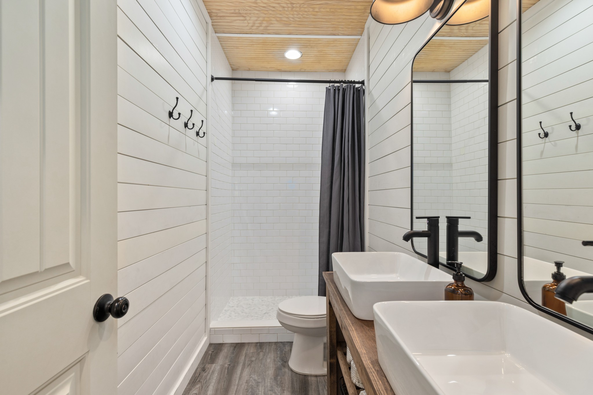 1818 Preacher Holt Road Mount Pleasant, TN 38474 - Photo 25 of 43 a bathroom with a bathtub shower sink vanity and toilet