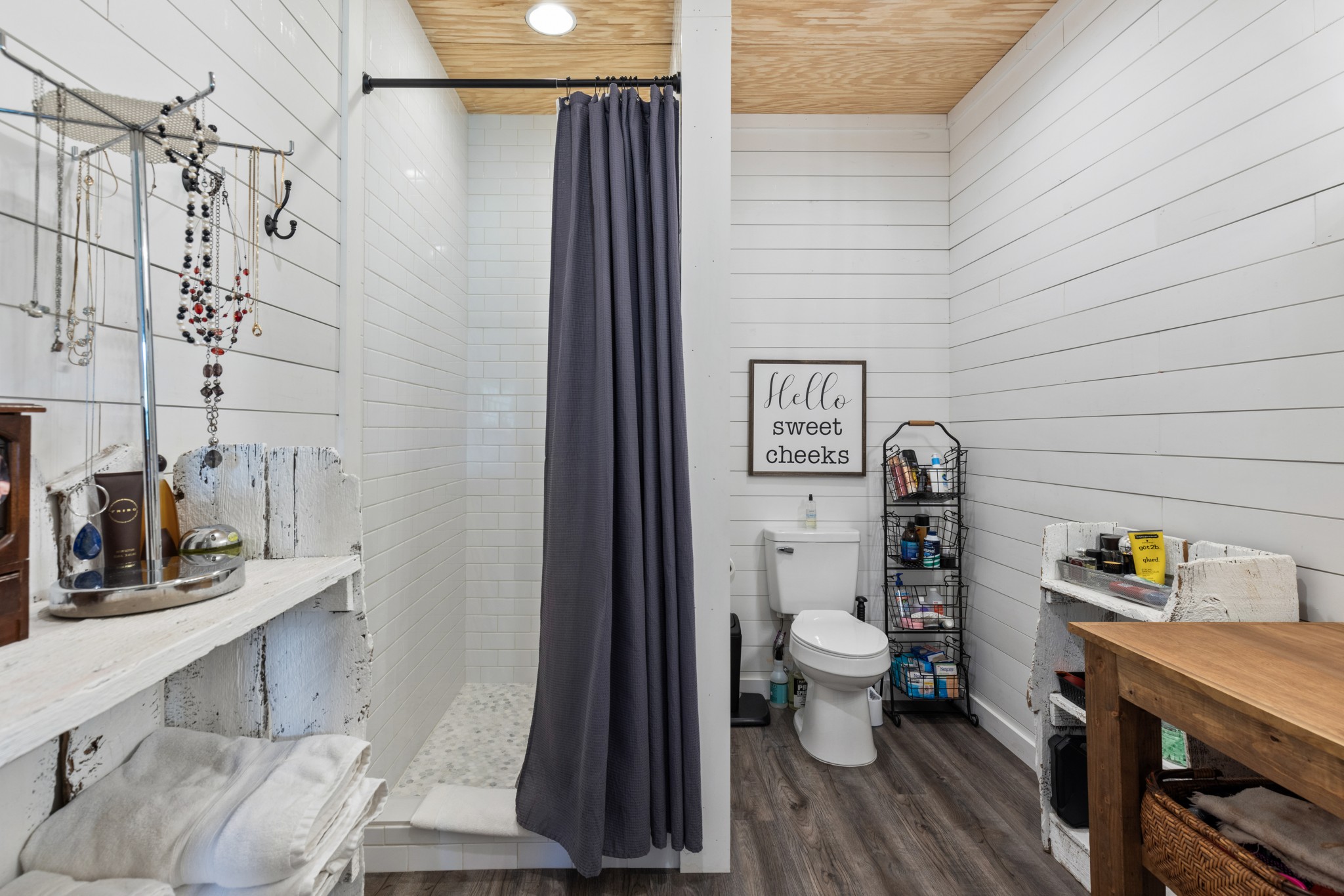 1818 Preacher Holt Road Mount Pleasant, TN 38474 - Photo 28 of 43 a bathroom with a toilet and a shower curtain