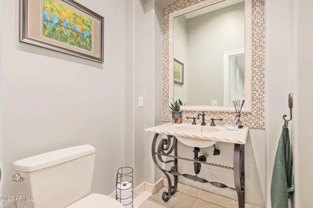 a view of a livingroom with furniture and a floor to ceiling window
