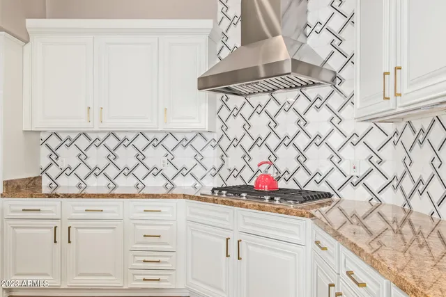 a view of a sink and cabinets