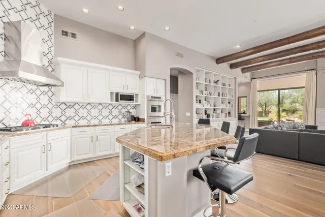 a view of a sink and cabinets