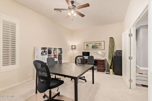 a view of a livingroom with furniture and a window