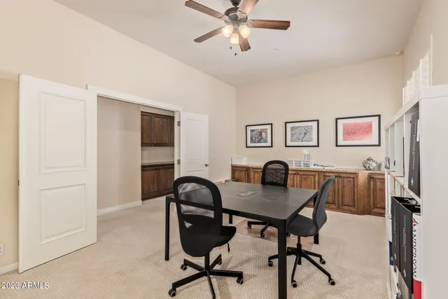 a workspace with furniture and window