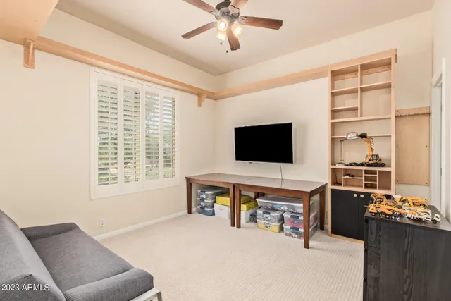 a bathroom with a granite countertop sink a toilet a mirror and bathtub