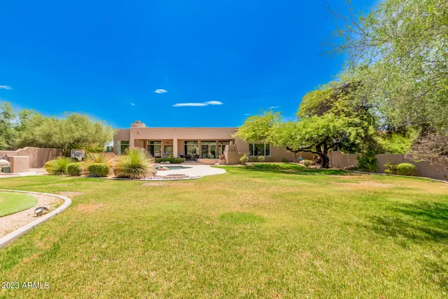 a view of a swimming pool with an outdoor seating