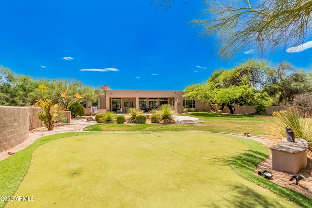 a view of a swimming pool with an outdoor space and seating area