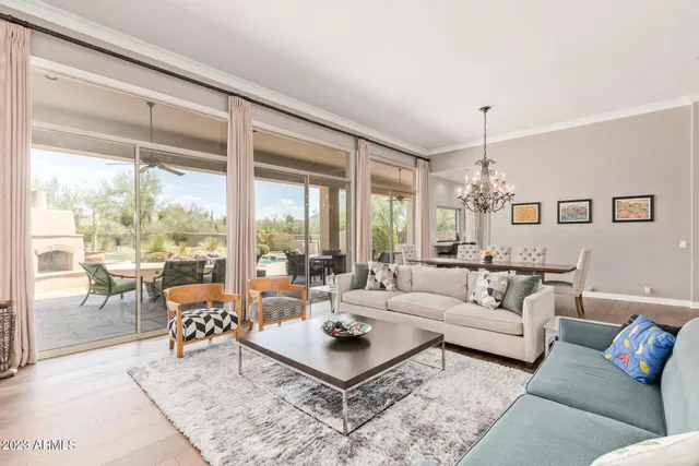 a view of an entryway with wooden floor and a floor to ceiling window