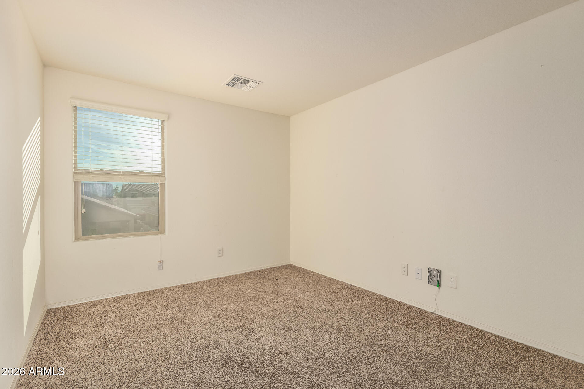 6203 West Evergreen Road Glendale, AZ 85302 - Photo 19 of 32 an empty room with a window