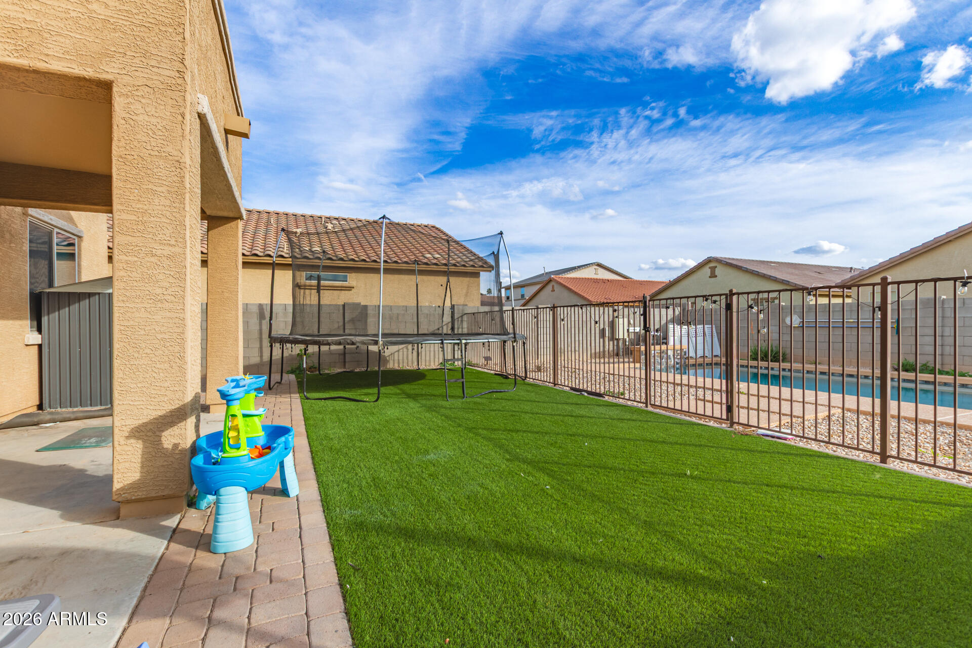 6203 West Evergreen Road Glendale, AZ 85302 - Photo 8 of 32 a view of an buildings with many windows and garden