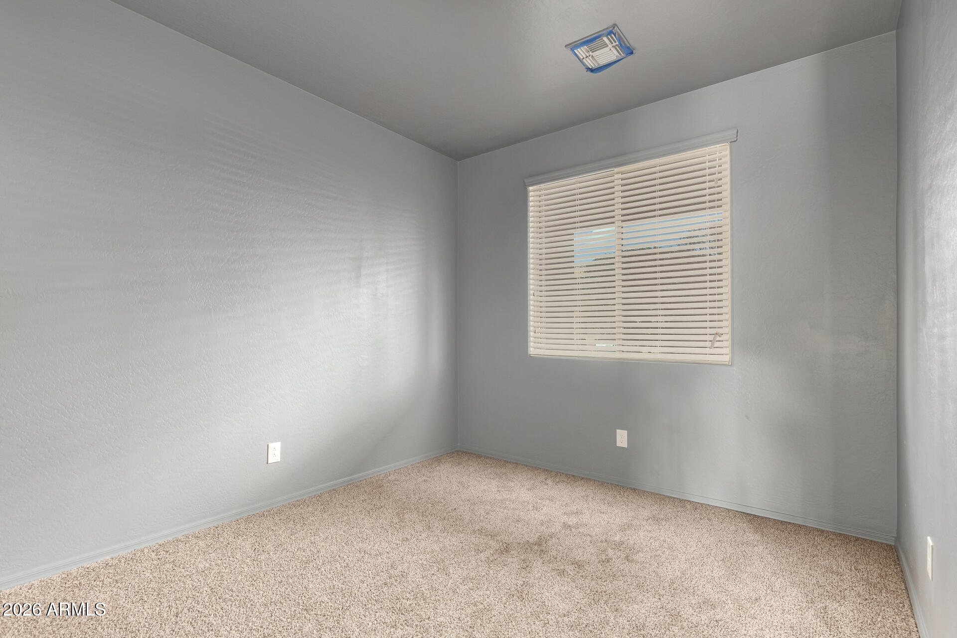 6203 West Evergreen Road Glendale, AZ 85302 - Photo 10 of 32 a view of an empty room with a window