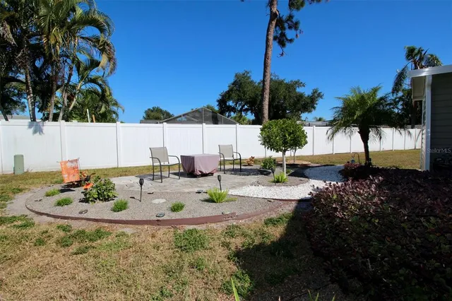 a dining room with a table and chairs and a fire pit