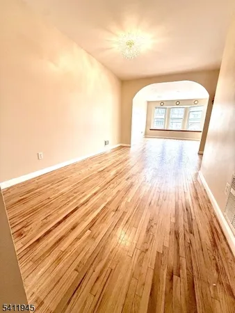 a view of a room with wooden floor and closet
