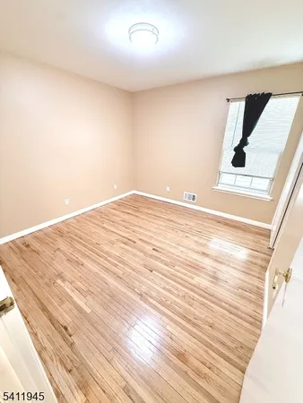 a view of a balcony with wooden floor