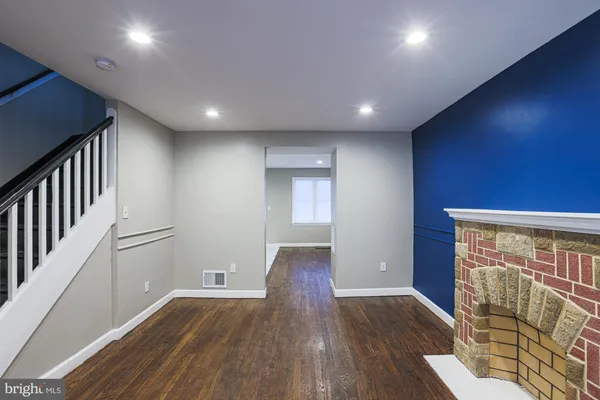 a view of entryway with wooden floor