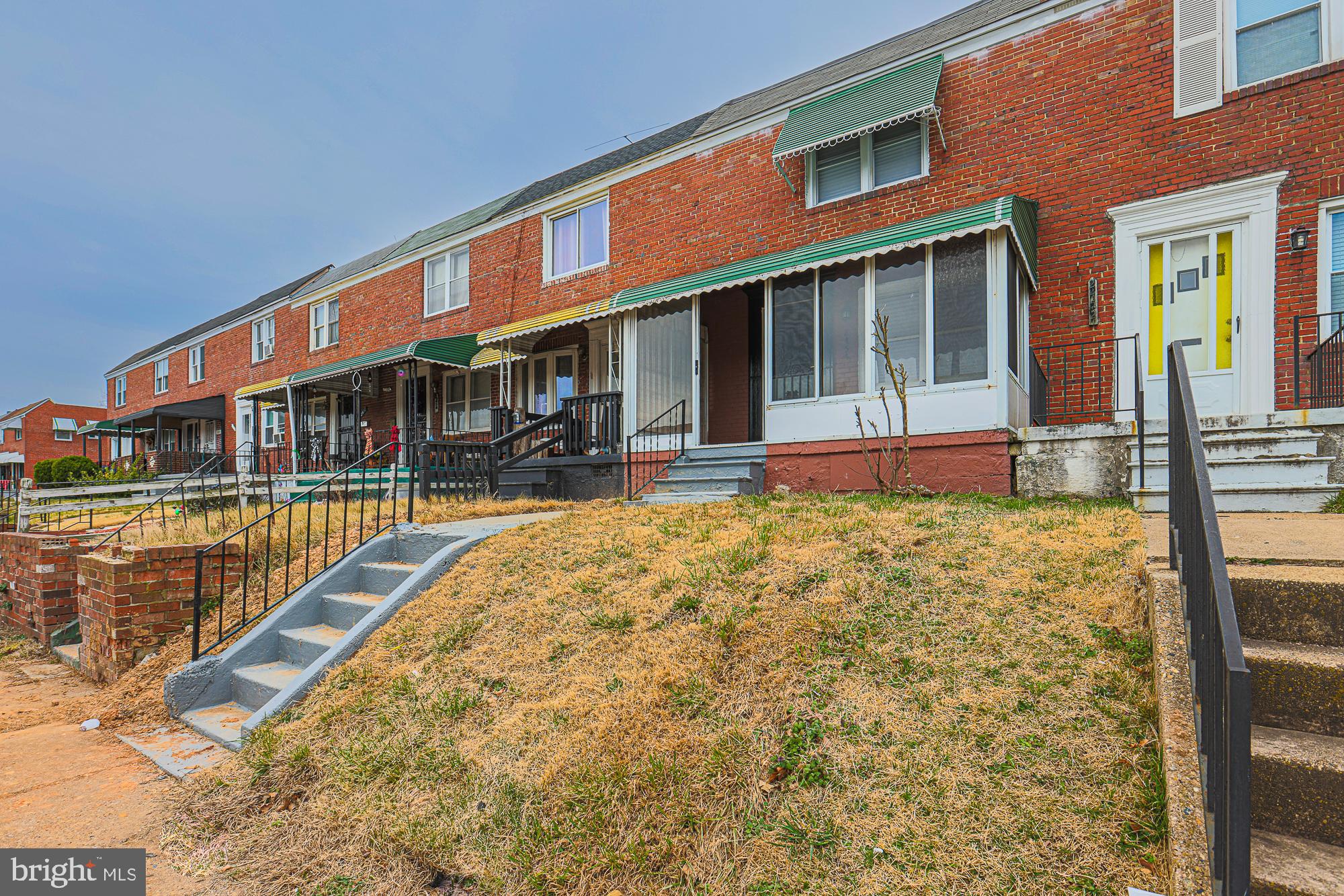 2454 Terra Firma Road Baltimore, MD 21225 - Photo 2 of 44 a front view of a building with a garden