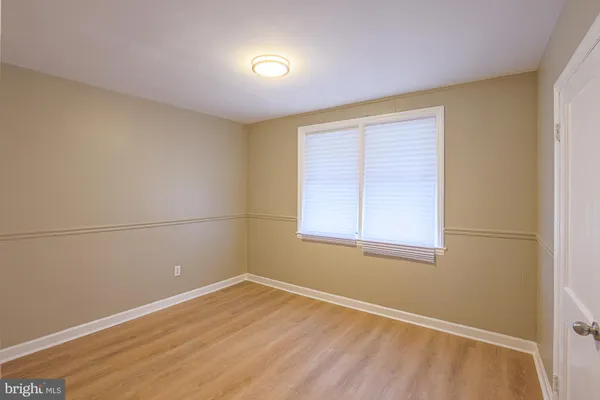 an empty room with a empty space and a window