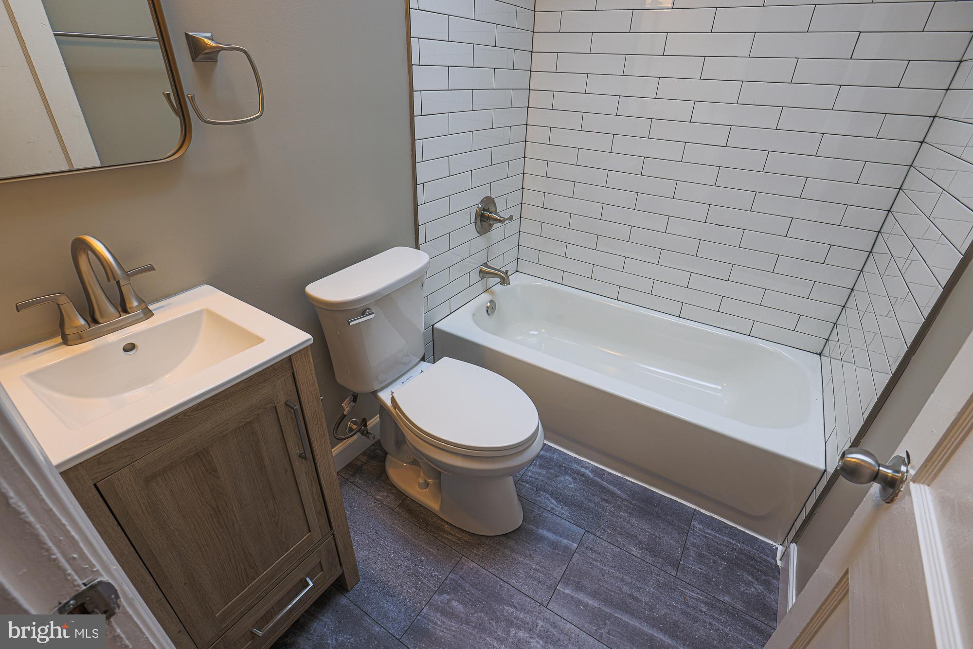 2454 Terra Firma Road Baltimore, MD 21225 - Photo 27 of 44 a bathroom with a toilet and a sink