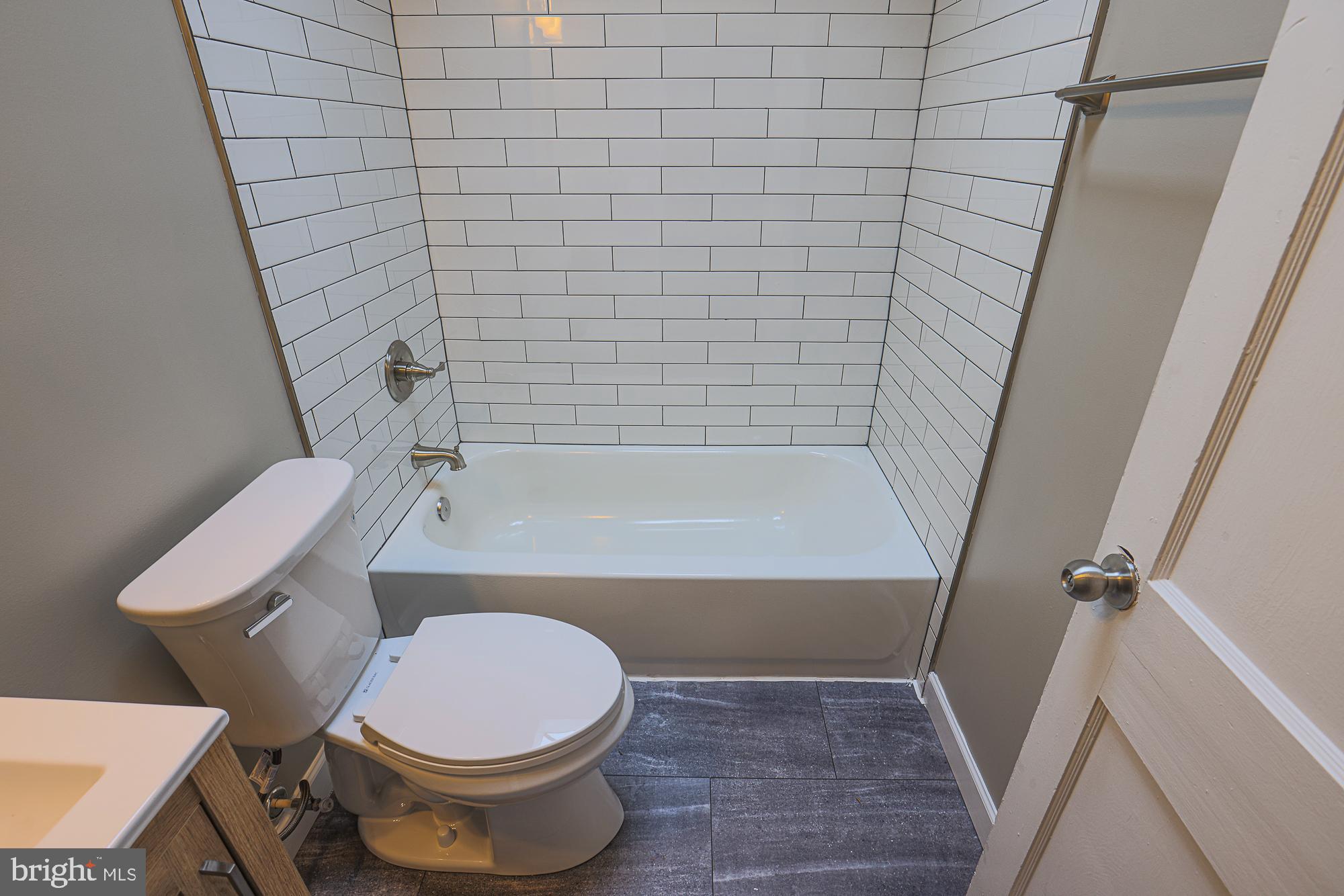 2454 Terra Firma Road Baltimore, MD 21225 - Photo 28 of 44 a bathroom with a toilet and a shower