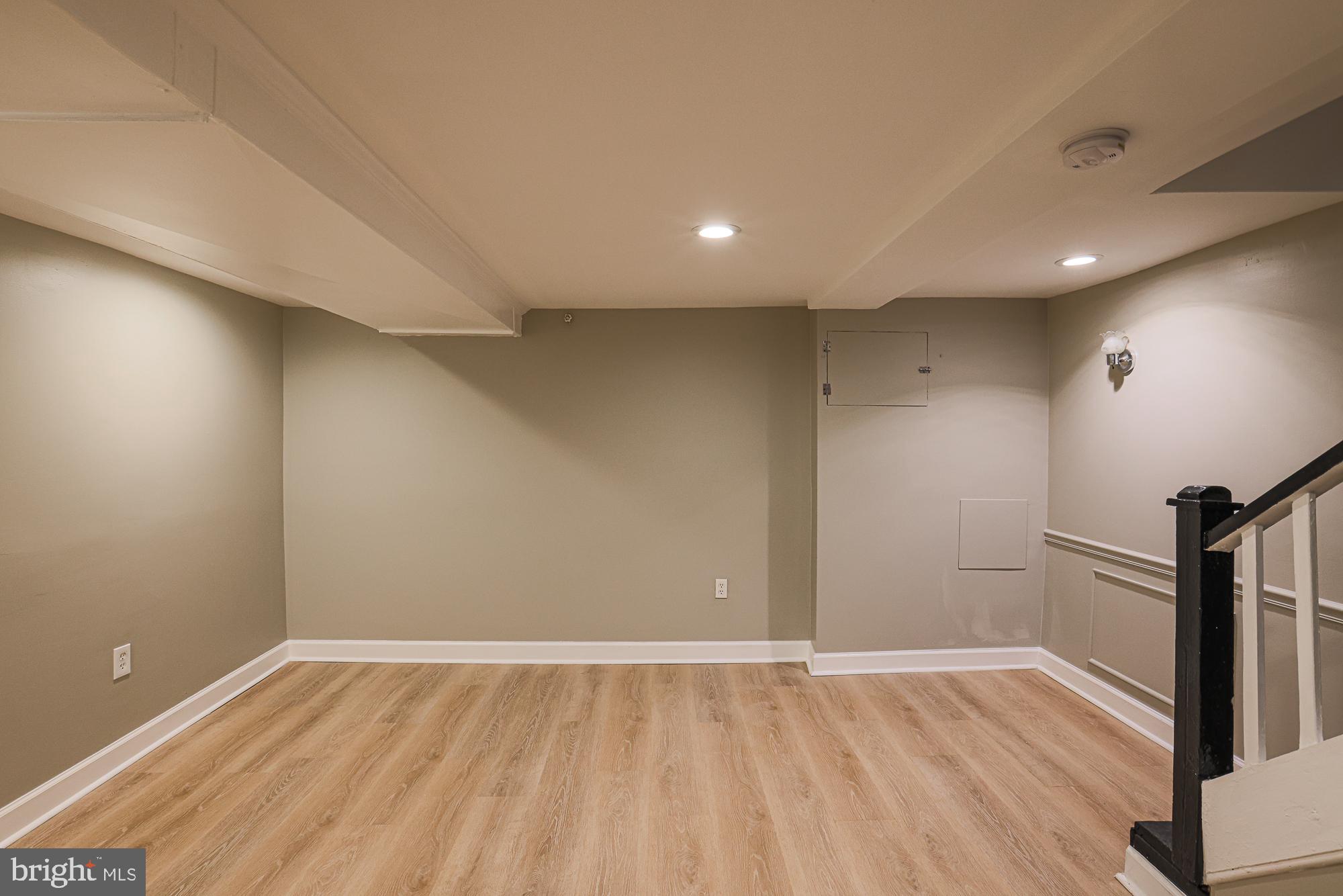2454 Terra Firma Road Baltimore, MD 21225 - Photo 32 of 44 an empty room with wooden floor and entrance