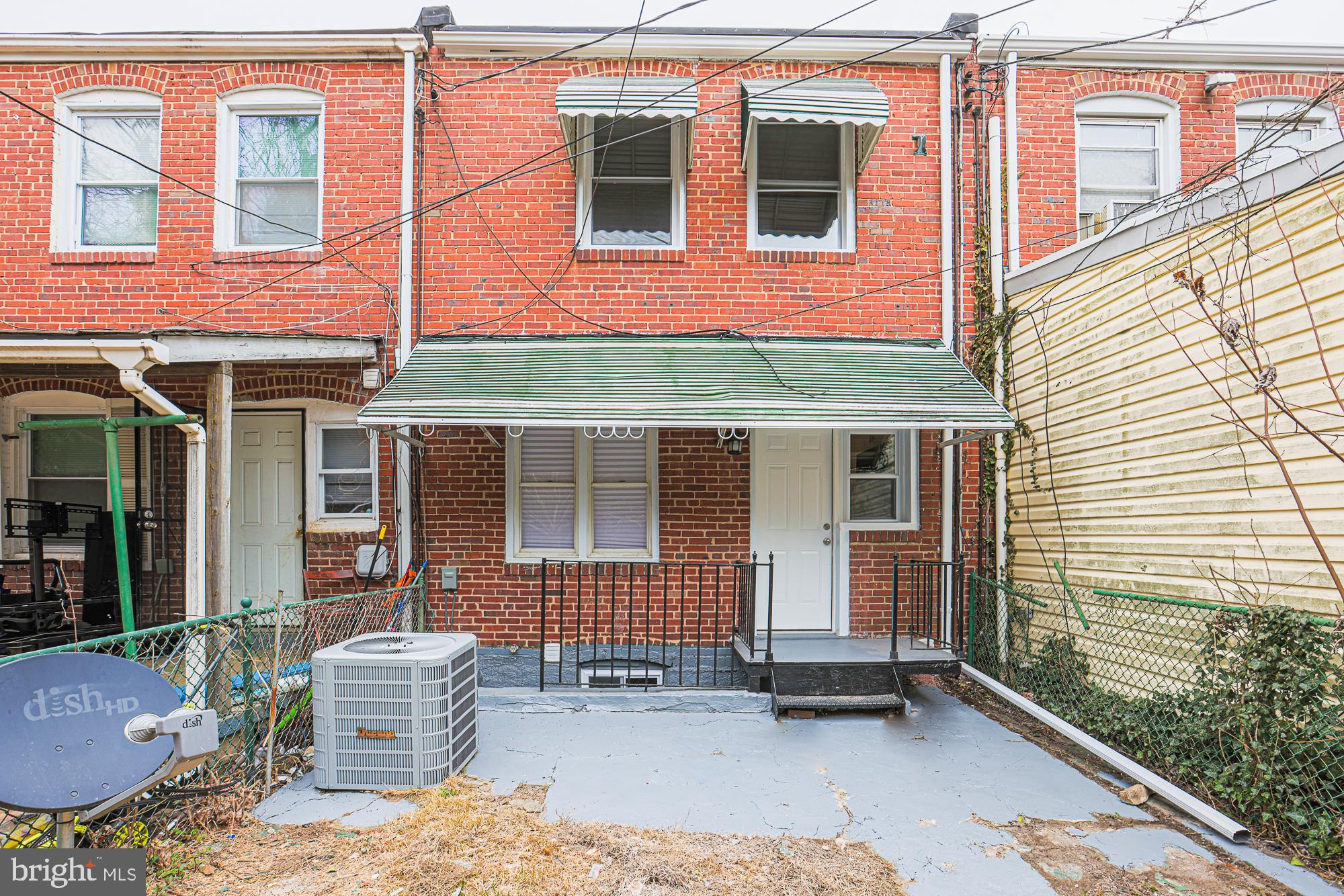 2454 Terra Firma Road Baltimore, MD 21225 - Photo 40 of 44 a backyard of a house with outdoor seating