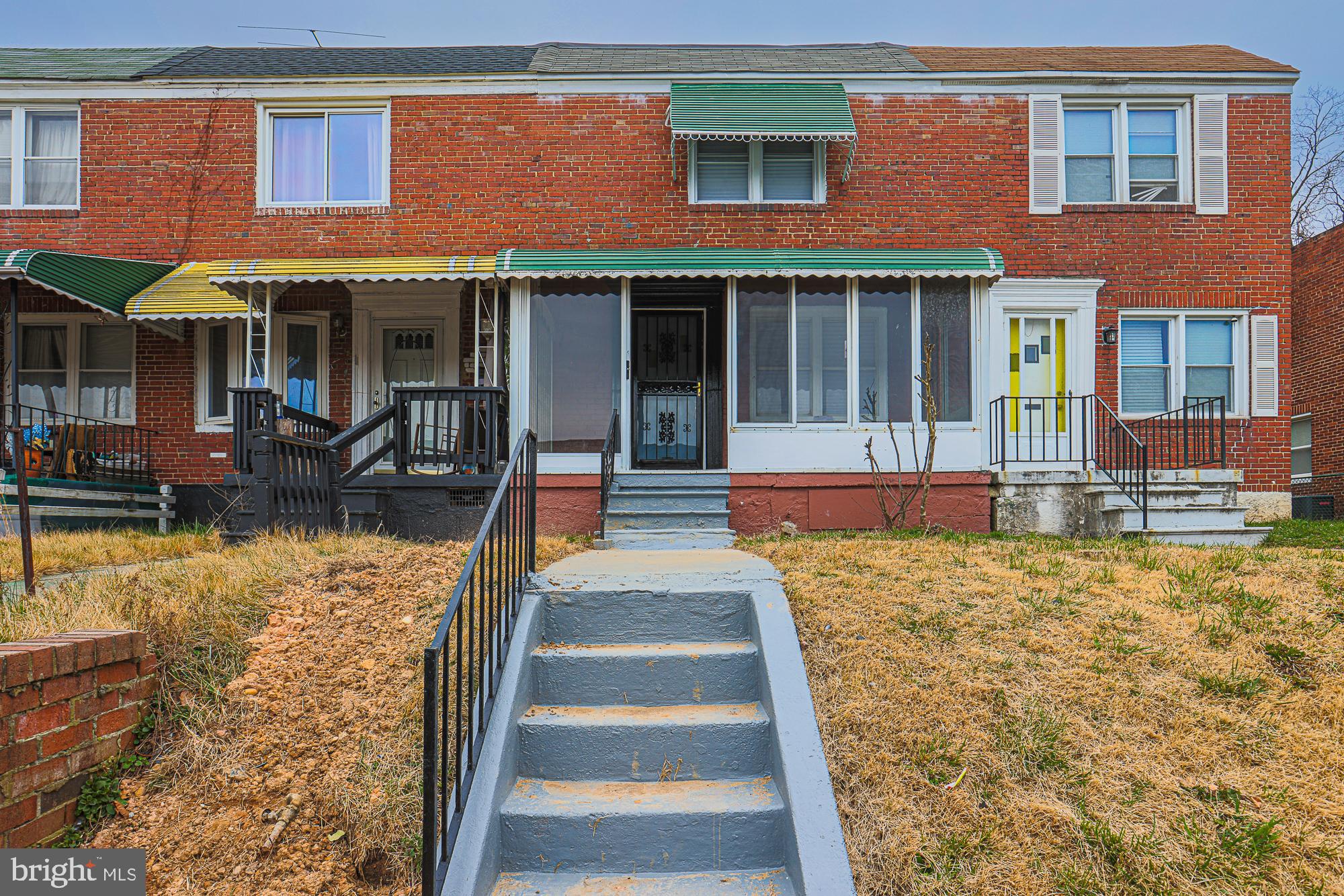 2454 Terra Firma Road Baltimore, MD 21225 - Photo 4 of 44 a front view of a house with a yard