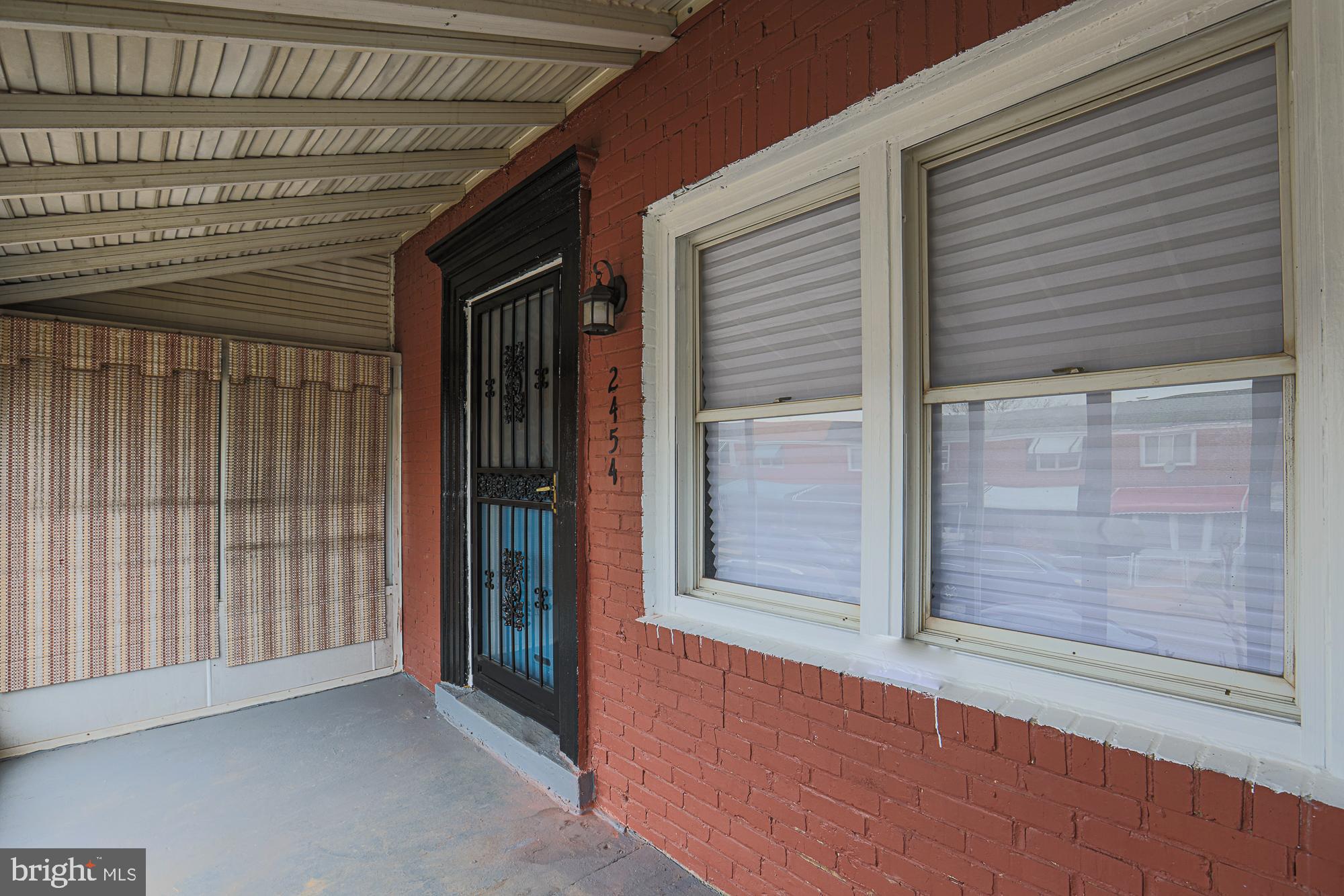 2454 Terra Firma Road Baltimore, MD 21225 - Photo 7 of 44 a view of an empty room with sliding door