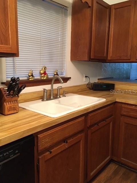 1712 Southwest 67th Terrace Gainesville, FL 32607 - Photo 2 of 10 a kitchen with a sink and cabinets