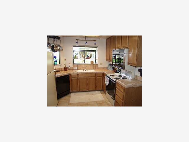 123 Redding Road, Unit B Campbell, CA 95008 - Photo 4 of 9 a kitchen with a sink and cabinets