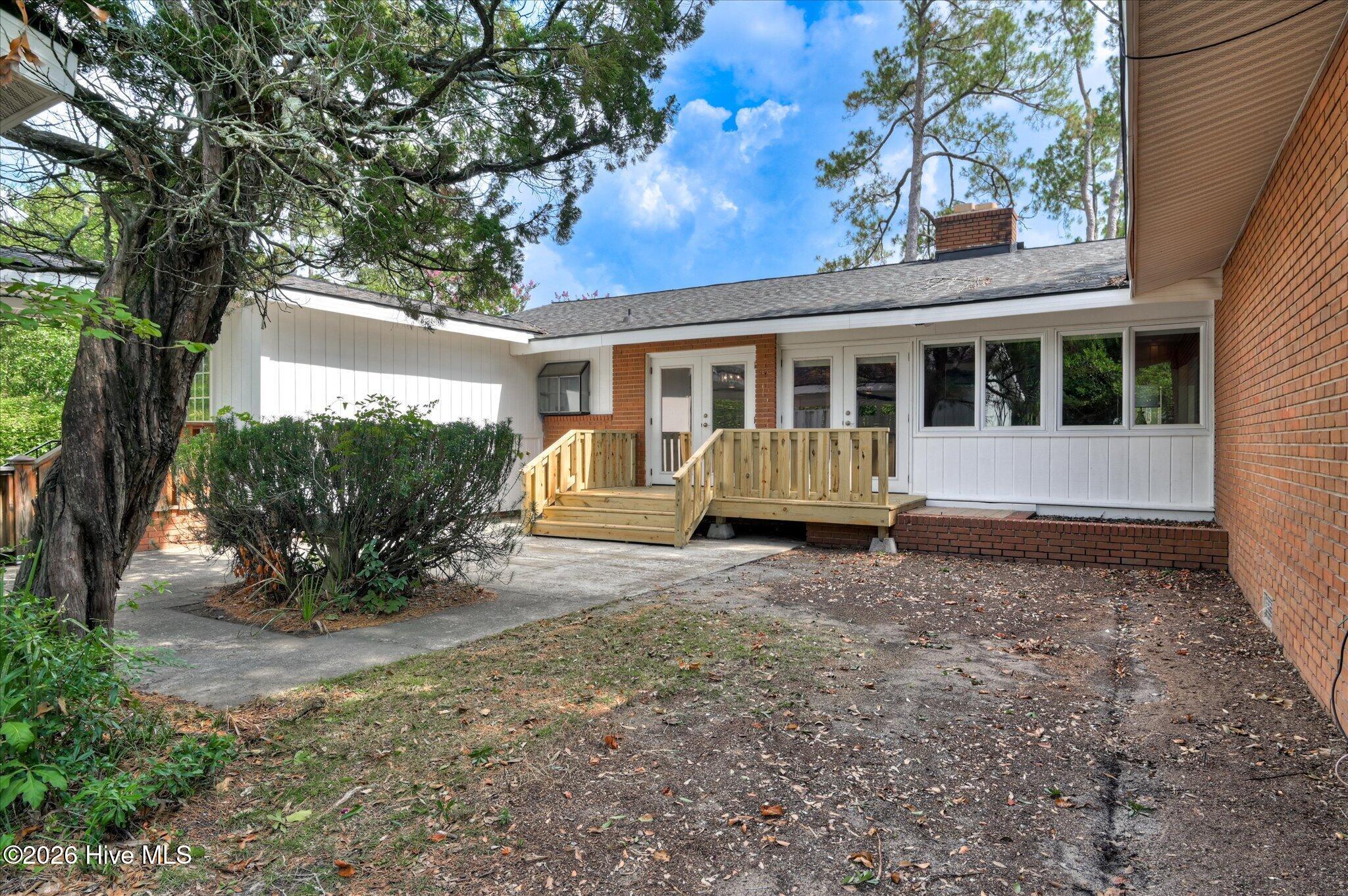 3033 Pine Needle Road Augusta, GA 30909 - Photo 39 of 40 Rear of home with original planter and patio area