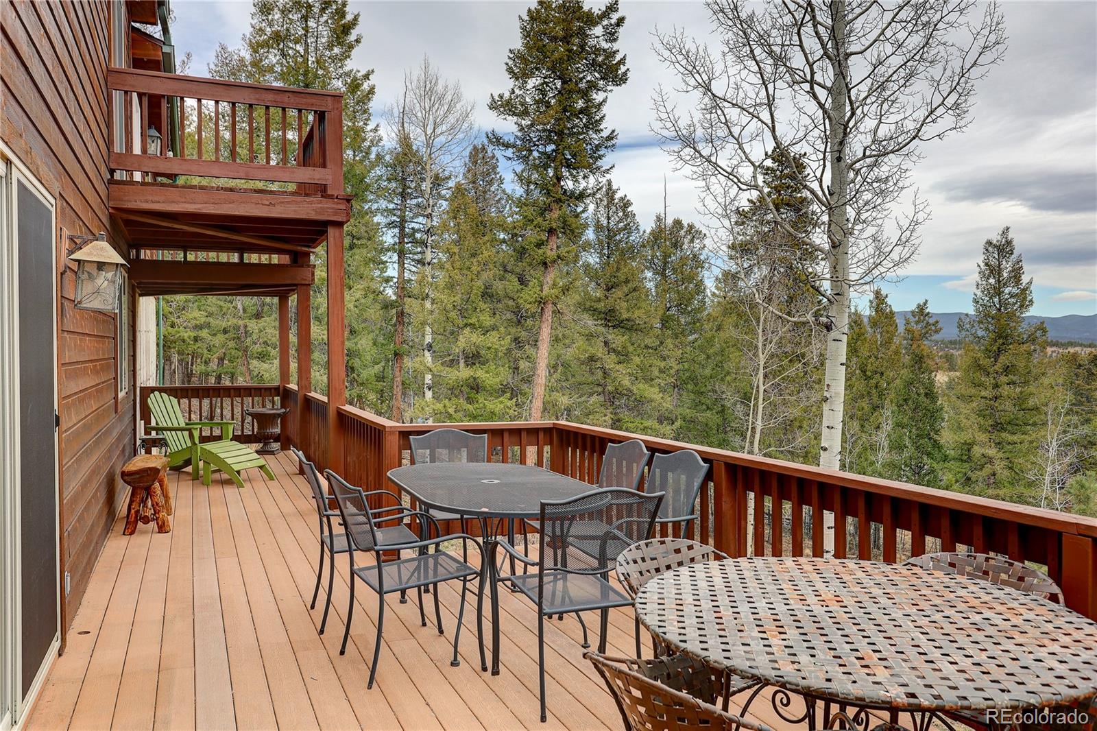261 Mt Bailey Drive Bailey, CO 80421 - Photo 14 of 28 a view of a chairs and table on the deck