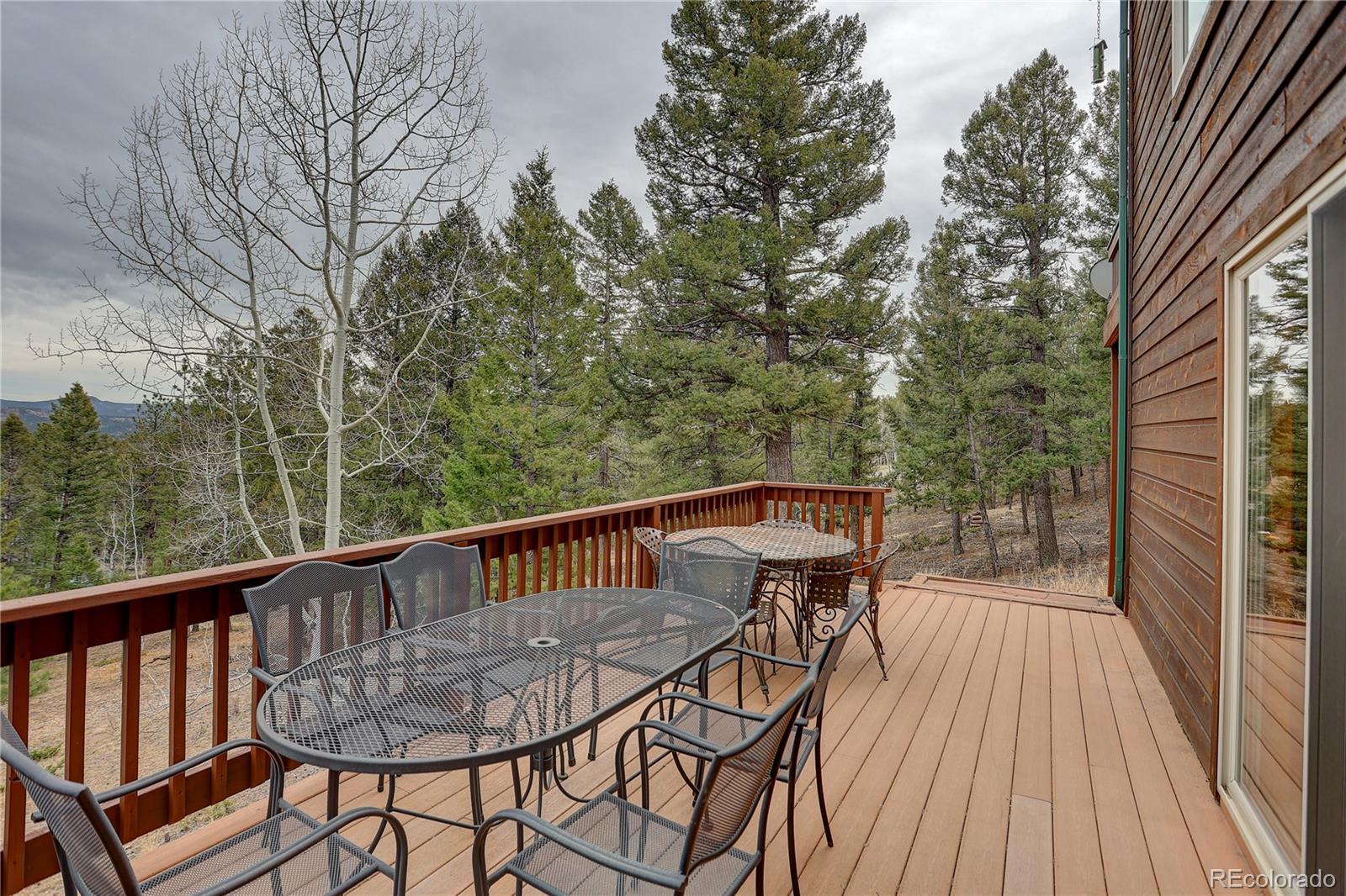 261 Mt Bailey Drive Bailey, CO 80421 - Photo 15 of 28 a view of a two chairs in the balcony