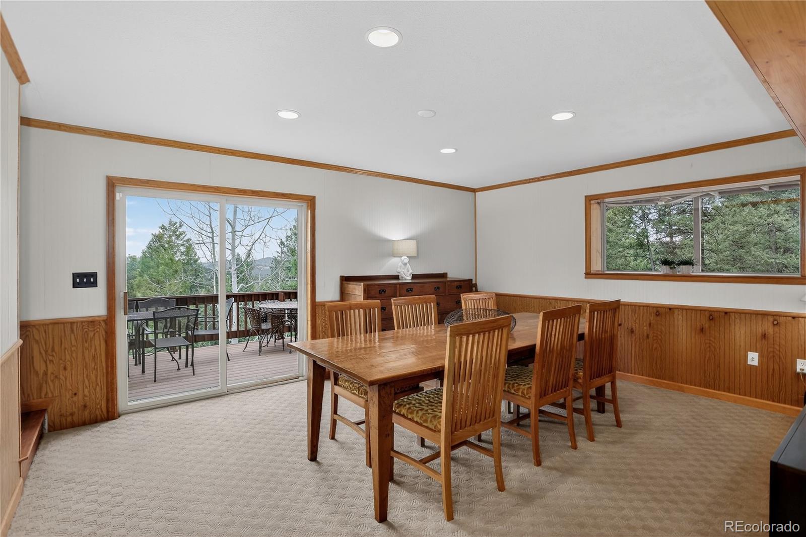 261 Mt Bailey Drive Bailey, CO 80421 - Photo 17 of 28 a view of a dining room with furniture water view and a window