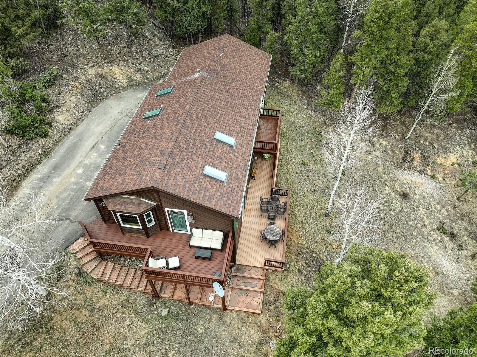 261 Mt Bailey Drive Bailey, CO 80421 - Photo 26 of 28 an aerial view of a house with a yard